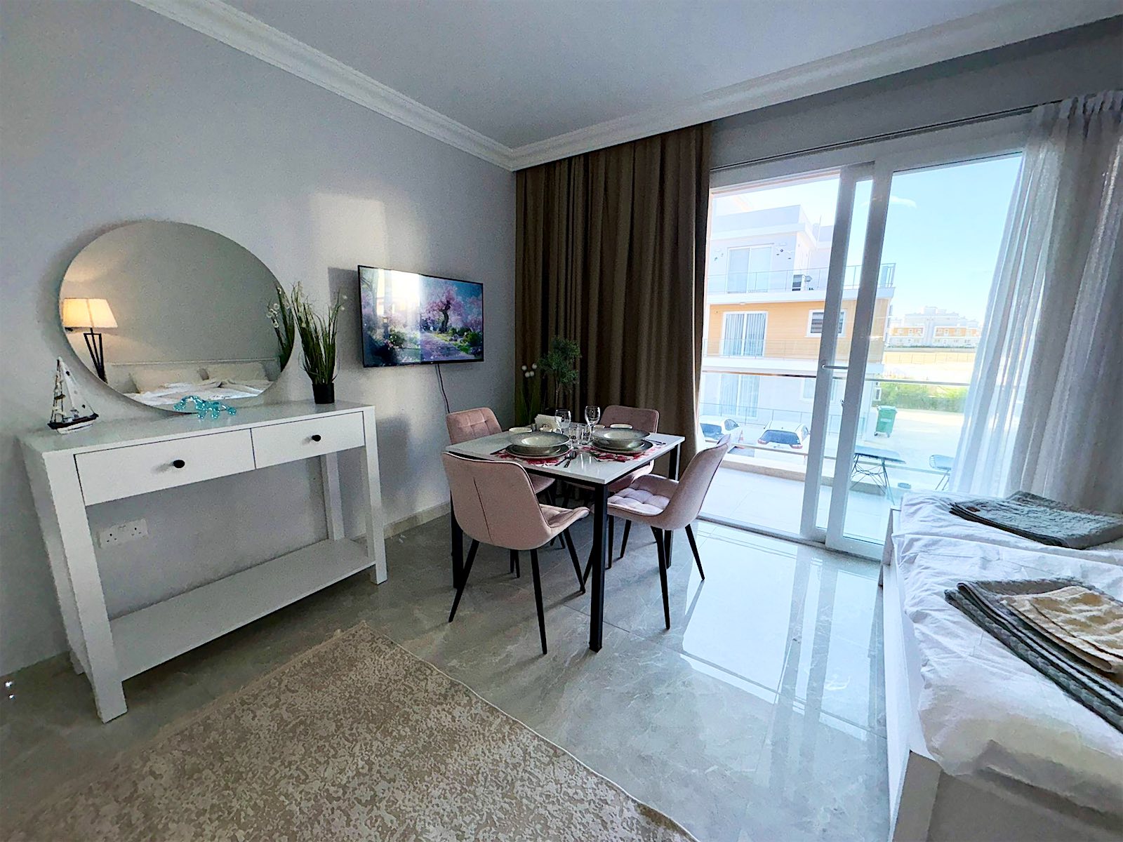 Royal studio: dining table, dressing table and the balcony door in one bright room
